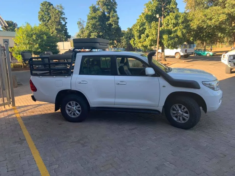Toyota Land Cruiser 200 double cab bakkie conversion fitted with a Safari raised air intake snorkel and game viewing frame.