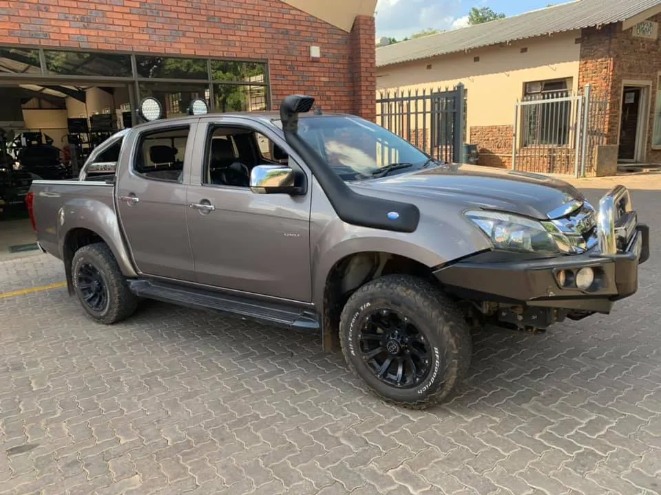 Grey Isuzu KB double cab fitted with a black steel replacement front bumper and snorkel