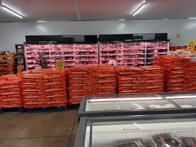 Meat display fridges and maize meal stacks at Jooste Butchery